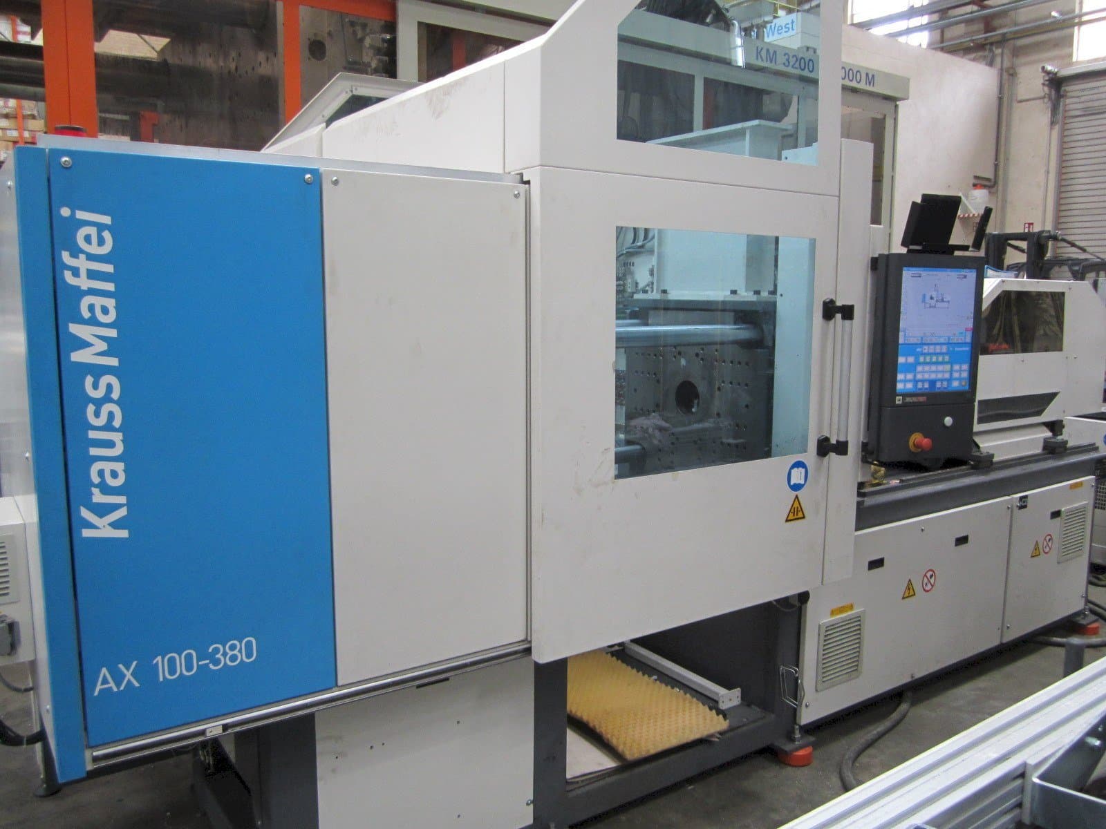 Vista Frontal da Krauss Maffei 100-380 AX máquina