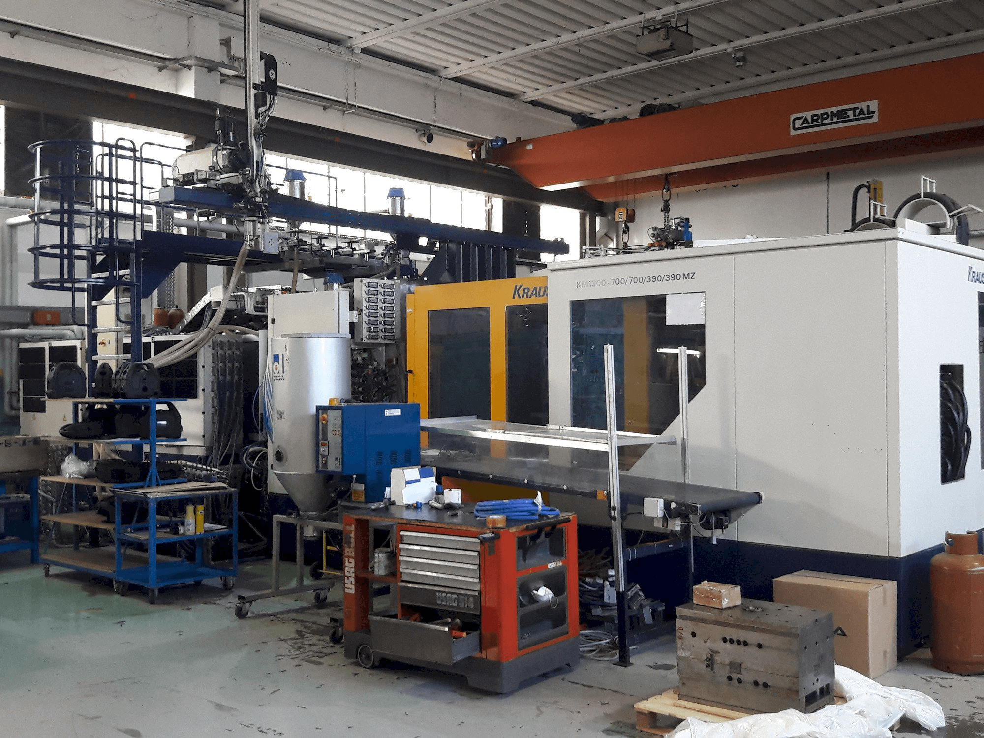 Vista Frontal da Krauss Maffei 1300-700-700-390-390 MZ máquina