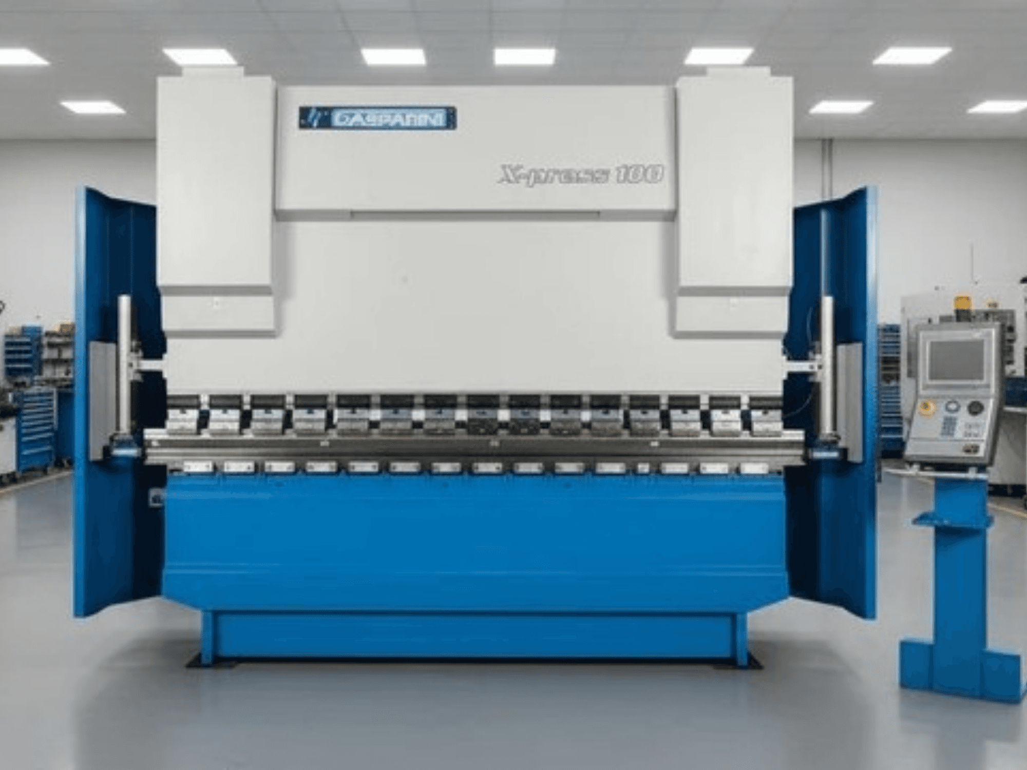 Prensa hidráulica GASPARINI X-Press 100, vista frontal, com exterior azul e painel de controlo no lado direito.