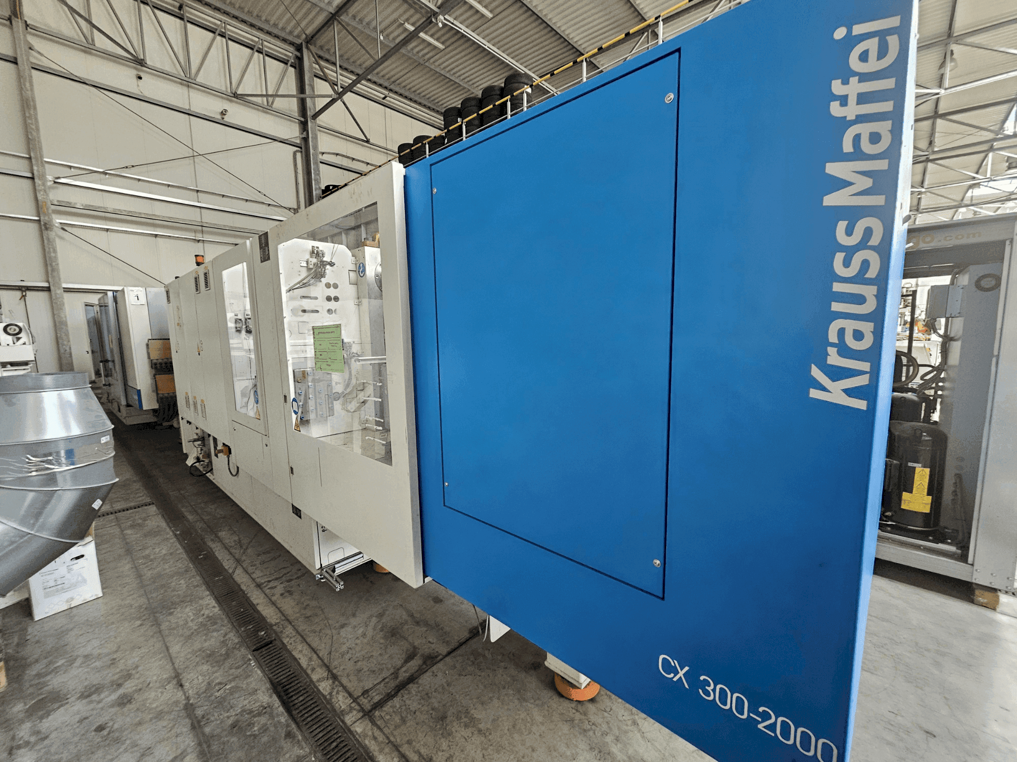 Vista Frontal da Krauss Maffei 300-2000 CX máquina