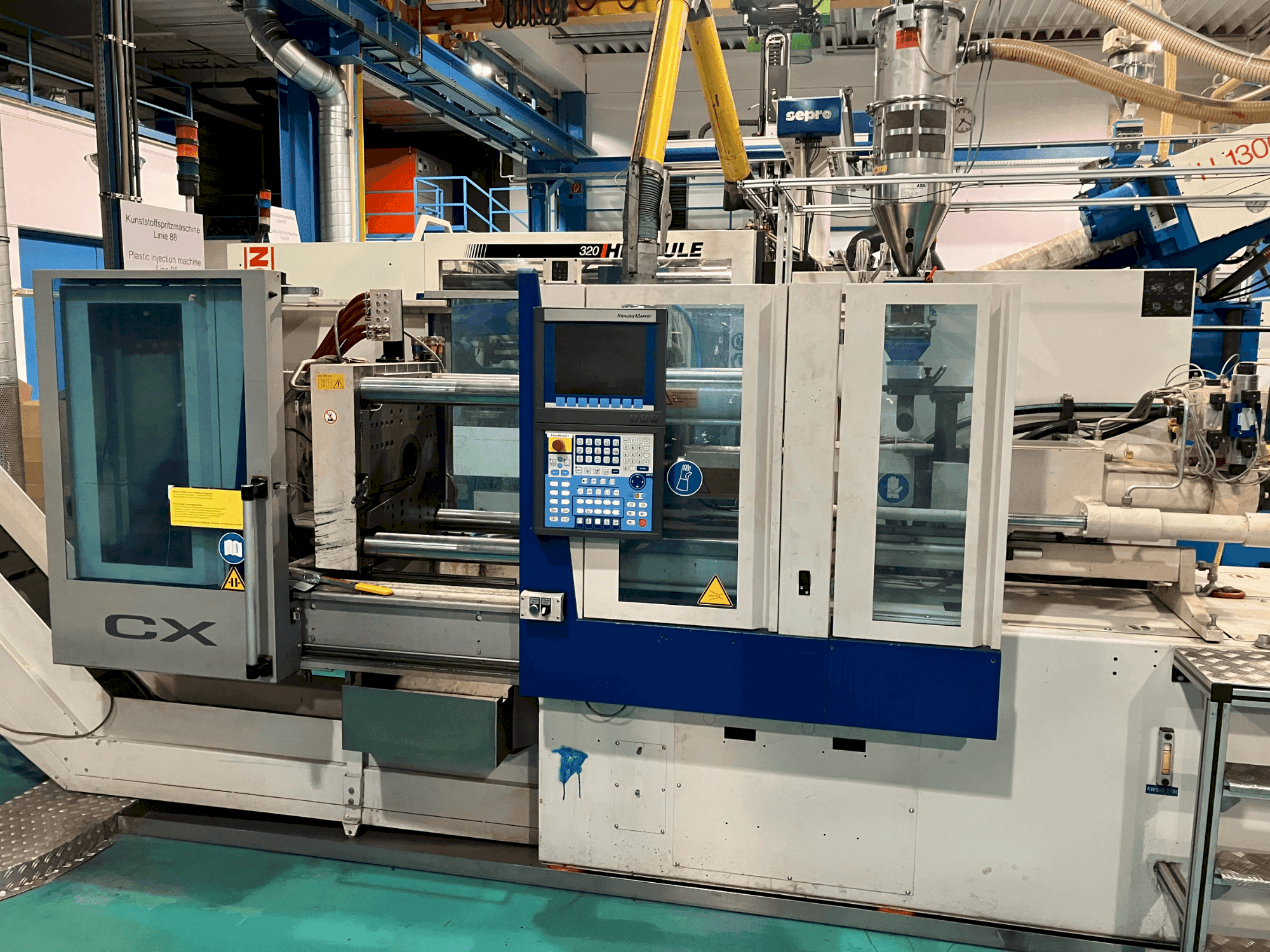 Vista Frontal da Krauss Maffei 65-180 CX máquina