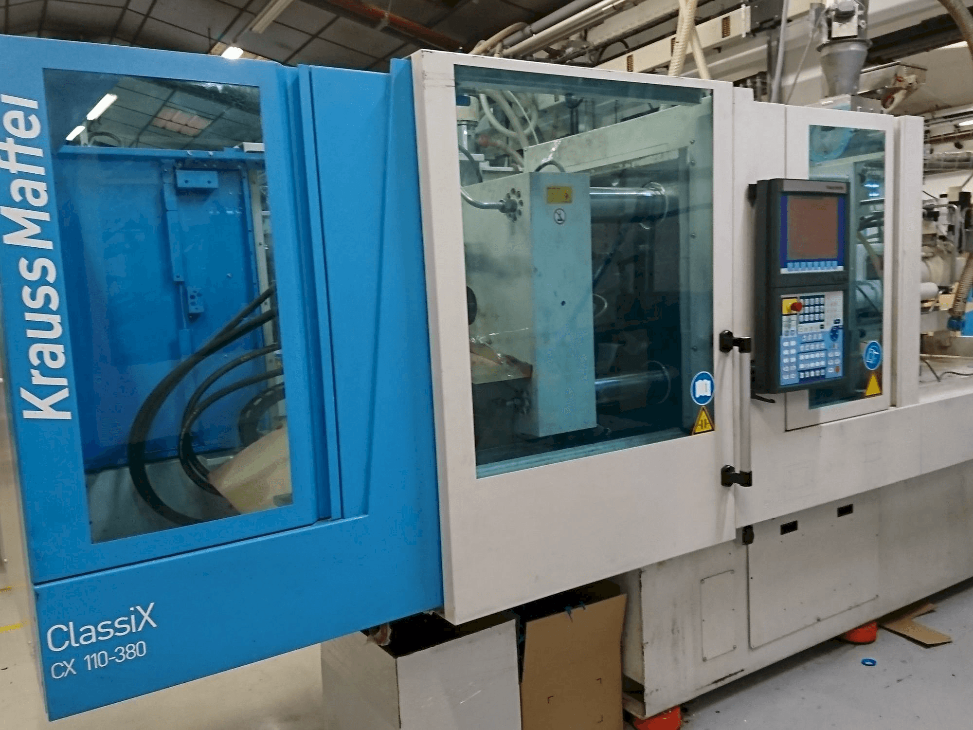Vista Frontal da Krauss Maffei 110-380 CX máquina