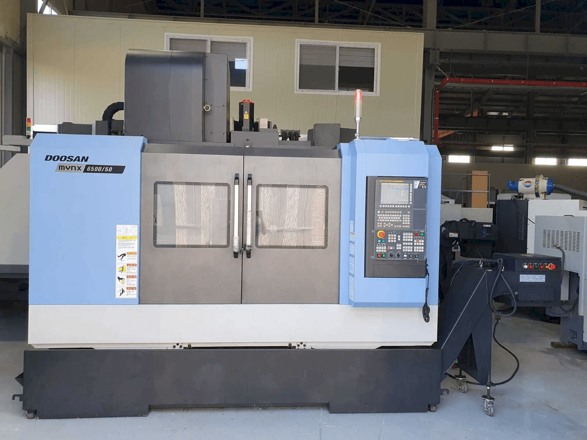 Vista Frontal da Doosan Mynx 6500/50 máquina