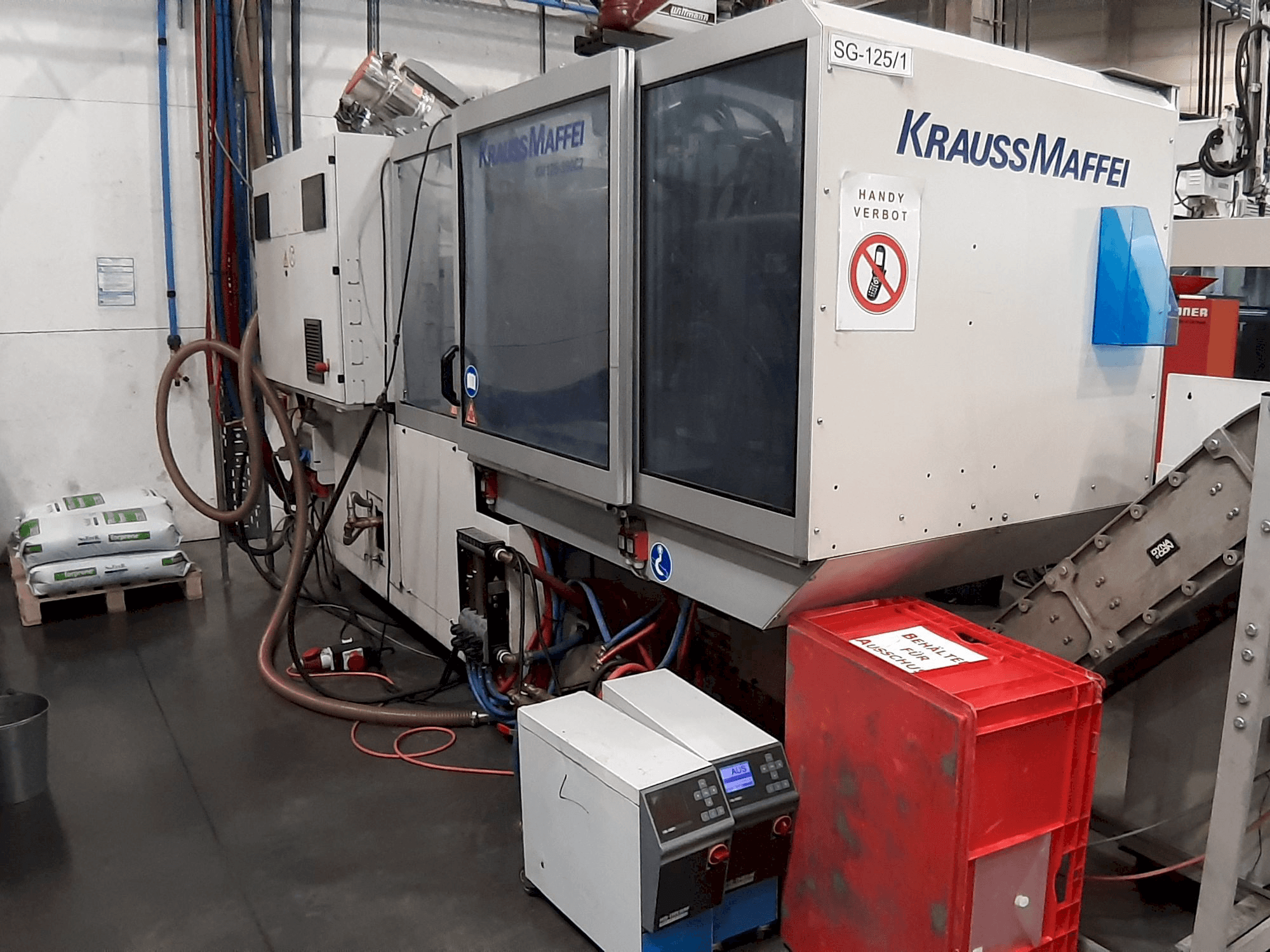 Vista Frontal da Krauss Maffei 125 - 390 CX máquina