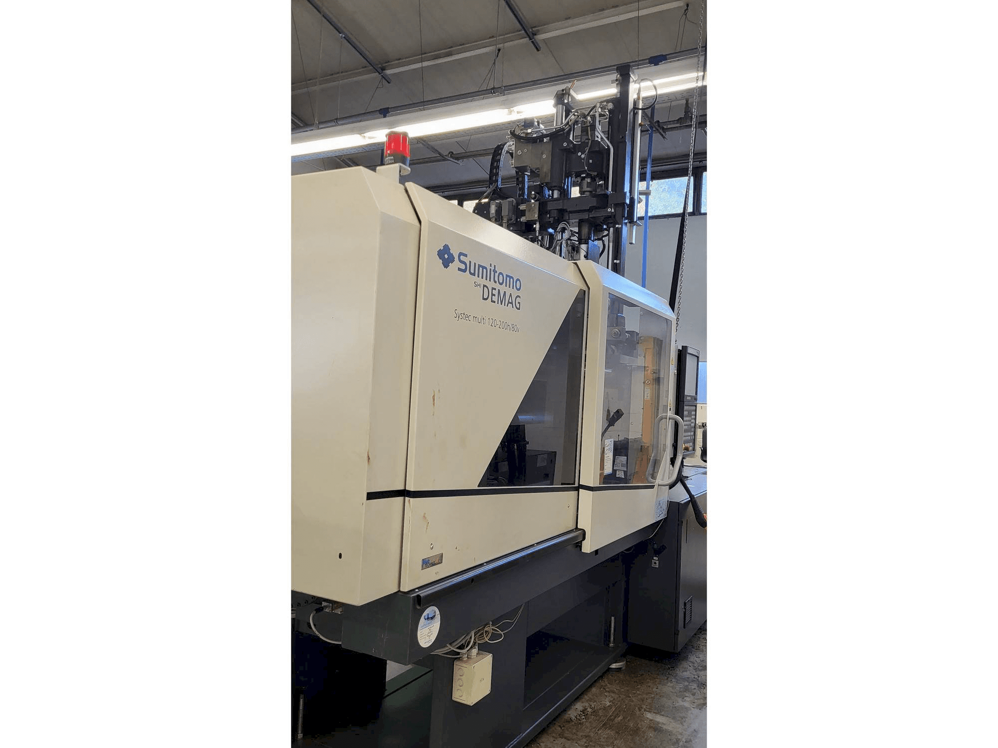 Vista Lateral Esquerda da Sumitomo SHI DEMAG Systec Multi 120/470-200h/80V máquina
