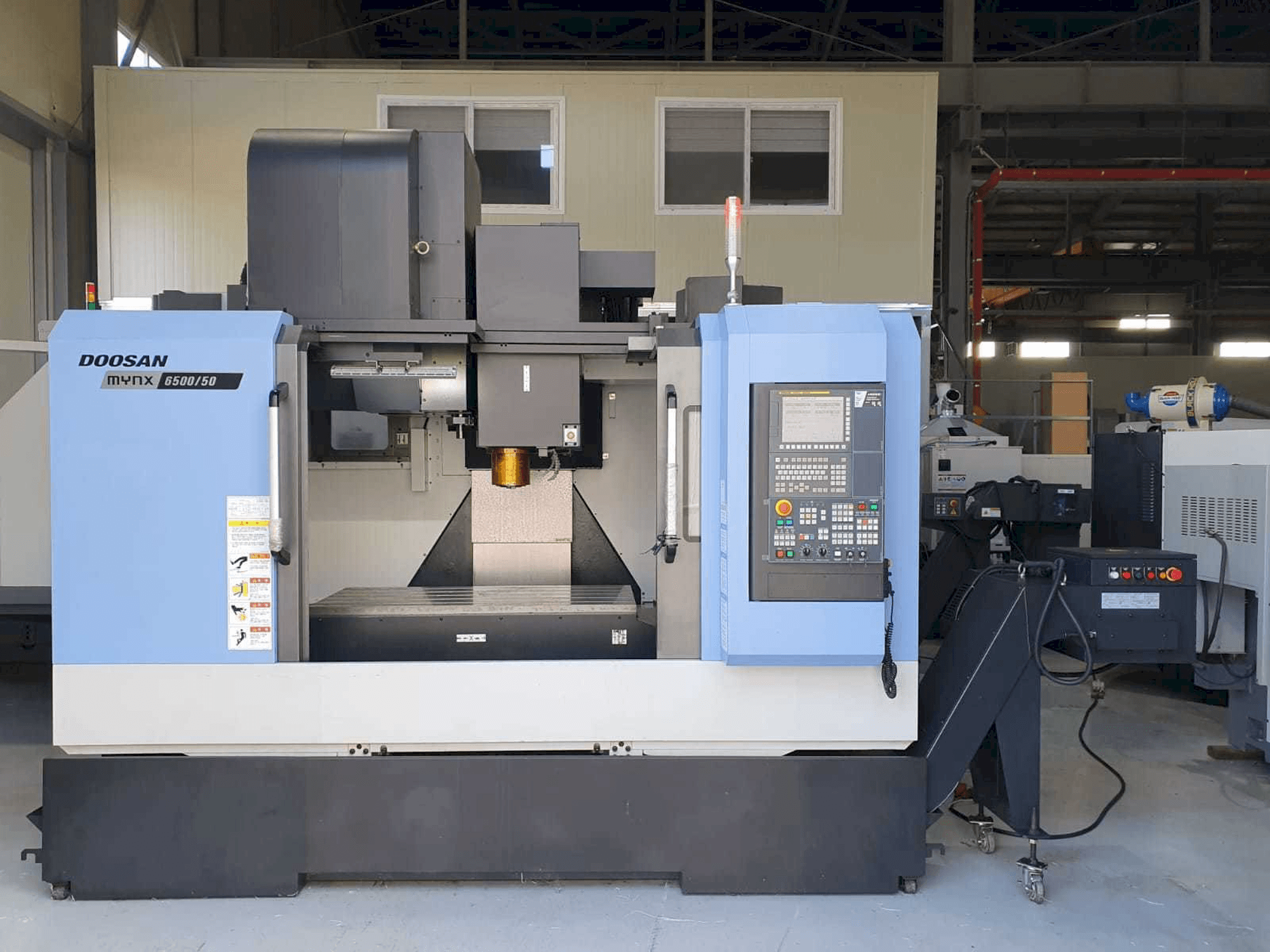 Vista Frontal da Doosan Mynx 6500/50 máquina