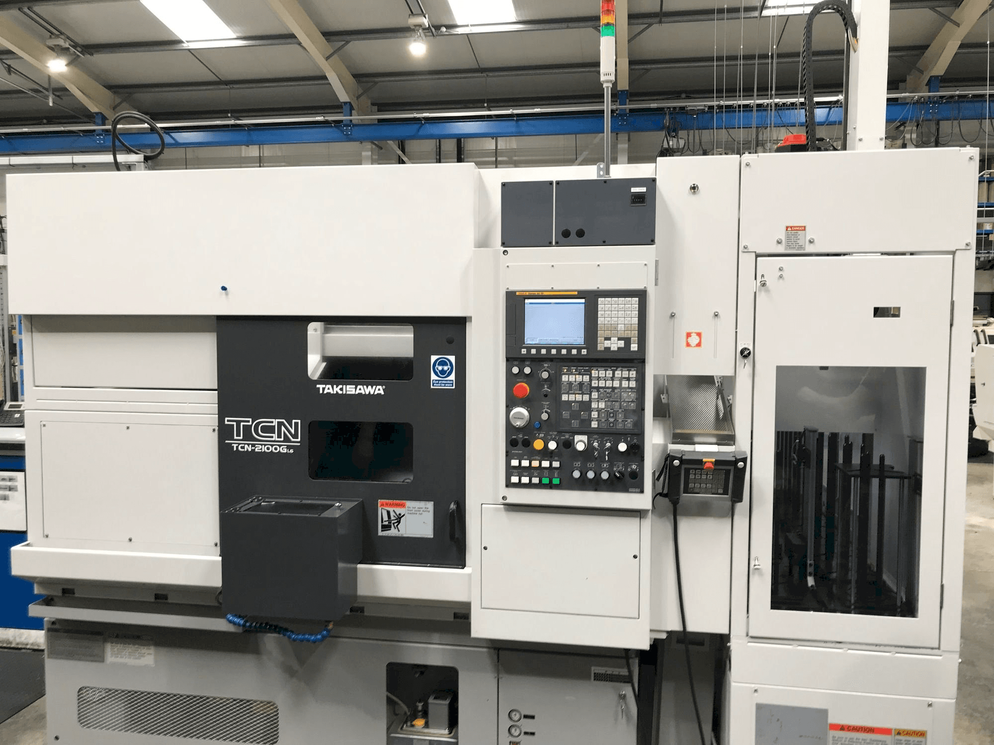 Vista Frontal da Takisawa TCN-2100G L6 máquina