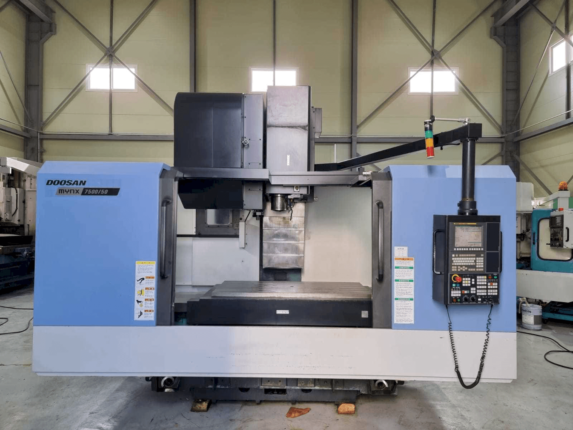 Vista Frontal da Doosan Mynx 7500/50 máquina