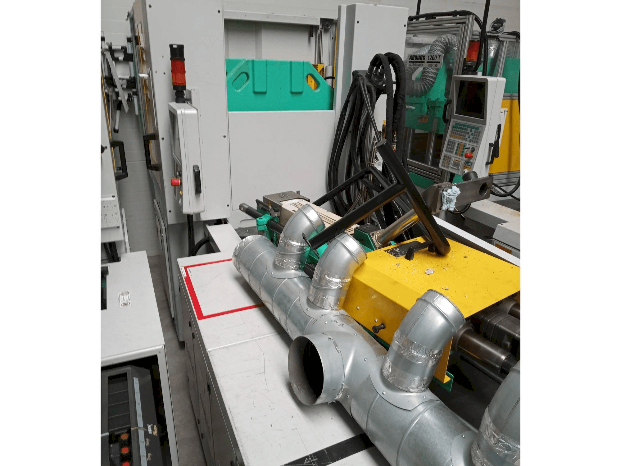 Vista Frontal da Arburg Allrounder 1200T-800-170 máquina